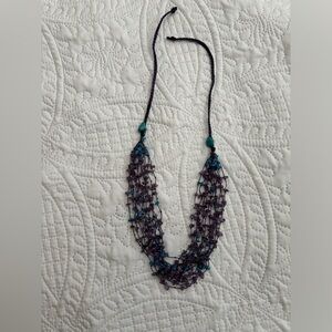 Turquoise and purple beaded multi strand necklace.
